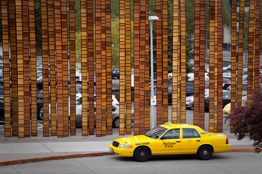 Yellow Cab and Fence Sculpture